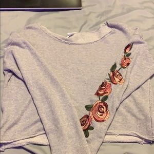 Long sleeve grey crop top.